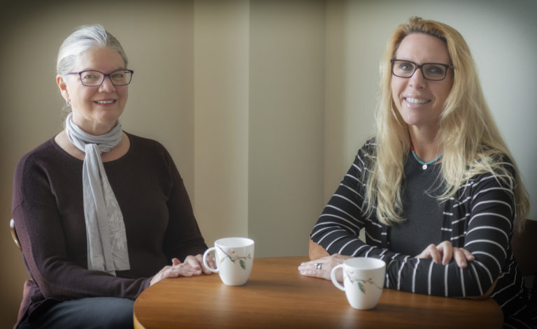 Image of Kathryn Still and Jill Hart sitting at a table